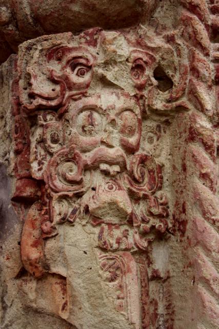 A detail of Stela B.  The original red paint that once adorned all of the stelae, has bled faint... but traces still remain.