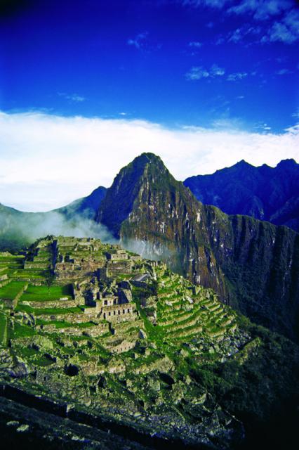 High view of the ancient ruins of Machu Picchu, Peru, known popularly throughout the world as the “Lost City of the Incas”